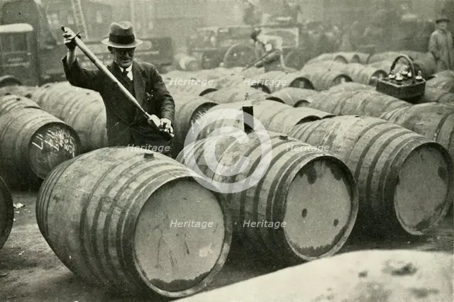 "There Are a Quarter of a Million Gallons of Port in the Port Vaults" - Wine Gauging Ground', 1937. Creator: Fox.