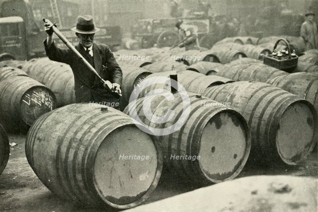 "There Are a Quarter of a Million Gallons of Port in the Port Vaults" - Wine Gauging Ground', 1937. Creator: Fox.