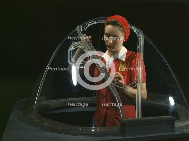 This girl in a glass house is putting finishing touches..., Long Beach, Calif. , 1942. Creator: Alfred T Palmer.
