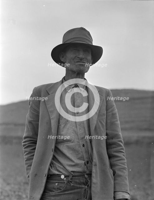 This man is a labor contractor in the pea fields of California, 1936. Creator: Dorothea Lange.