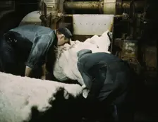 This sheet of synthetic rubber coming off the rolling mill...B.F. Goodrich Co., Akron, Ohio, 1941. Creator: Alfred T Palmer