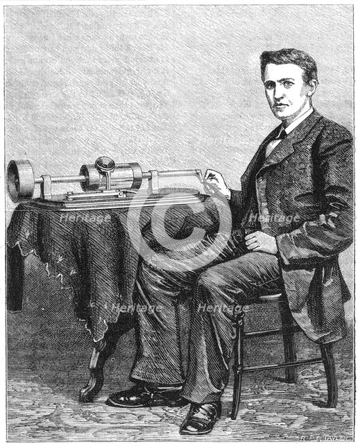 Thomas Alva Edison, American inventor, with an early hand-driven model of his phonograph, 1878. Creator: Unknown.
