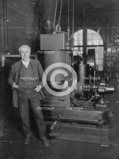 Thomas Alva Edison, American inventor, with his first dynamo for producing electric light, 1880s. Creator: Unknown.