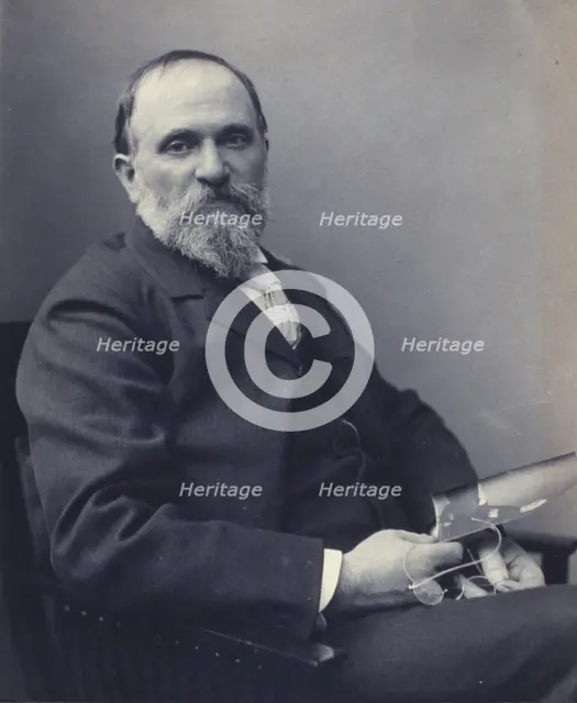 Thomas Hovenden, artist, seated, holding a photograph(?), facing front, half-length portrait, c1895. Creator: Clayton Stone Harris.