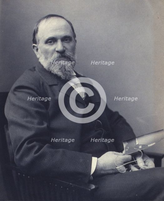 Thomas Hovenden, artist, seated, holding a photograph(?), facing front, half-length portrait, c1895. Creator: Clayton Stone Harris.