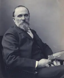 Thomas Hovenden, artist, seated, holding a photograph(?), facing front, half-length portrait, c1895. Creator: Clayton Stone Harris