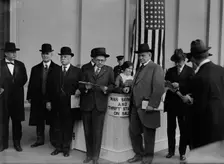 Thomas Riley Marshall, John Austin Moon, Champ Clark Buying War Savings And Thrift Stamps, 1918. Creator: Harris & Ewing