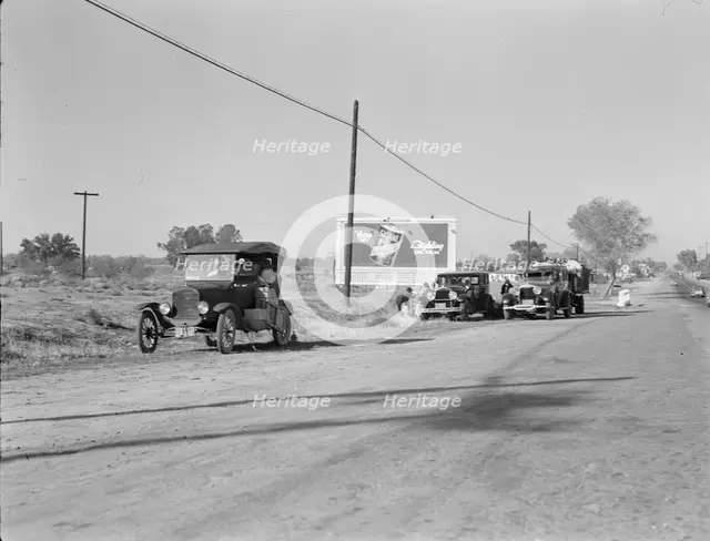 Three carloads of Mexicans headed for the Imperial Valley to harvest peas, near Bakersfield, CA,1936 Creator: Dorothea Lange.