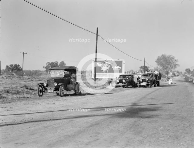Three carloads of Mexicans headed for the Imperial Valley to harvest peas, near Bakersfield, CA,1936 Creator: Dorothea Lange.