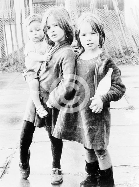 Three children, Chalk Farm, Camden, London, 1965.  Creator: Henry Grant.