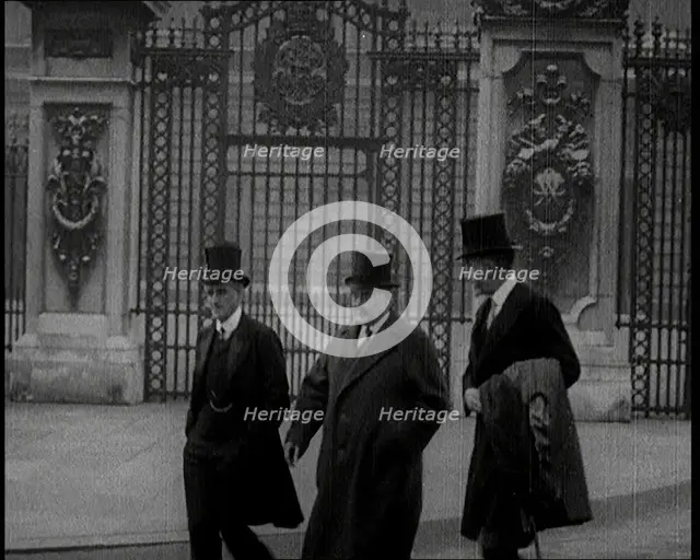 Three British Male Members of Parliament Walking Away from Buckingham Palace, 1924. Creator: British Pathe Ltd.