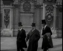 Three British Male Members of Parliament Walking Away from Buckingham Palace, 1924. Creator: British Pathe Ltd