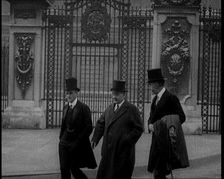 Three British Male Members of Parliament Walking Away from Buckingham Palace, 1924. Creator: British Pathe Ltd