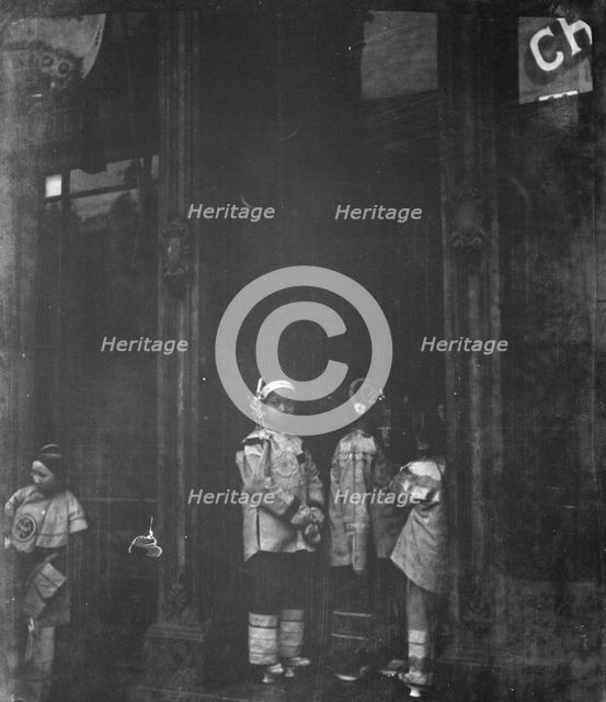 Three girls standing in a doorway, Chinatown, San Francisco, between 1896 and 1906. Creator: Arnold Genthe.
