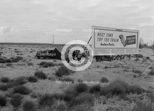Three families camped on the plains along US99 in California, 1938. Creator: Dorothea Lange.