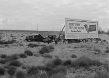 Three families camped on the plains along US99 in California, 1938. Creator: Dorothea Lange