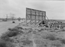 Three families camped on the plains along US 99 in California, 1938. Creator: Dorothea Lange