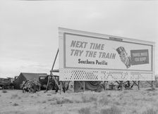 Three families camped on the plains along US 99 in California, 1938. Creator: Dorothea Lange