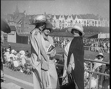 Three Female Civilians Wearing Smart Summer Outfits Posing for the Camera in a Horse Race, 1920. Creator: British Pathe Ltd
