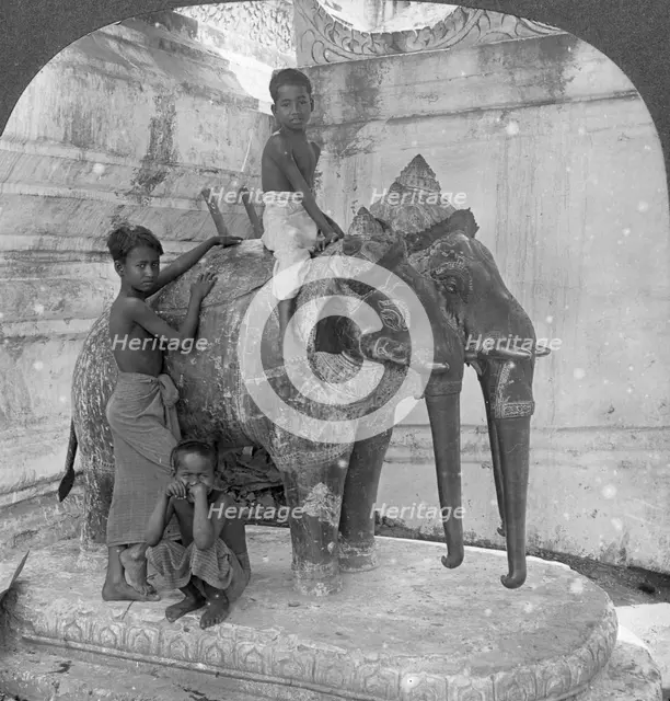 Three headed elephant guarding a sanctuary, Arakan Pagoda, Mandalay, Burma, 1908.  Artist: Stereo Travel Co