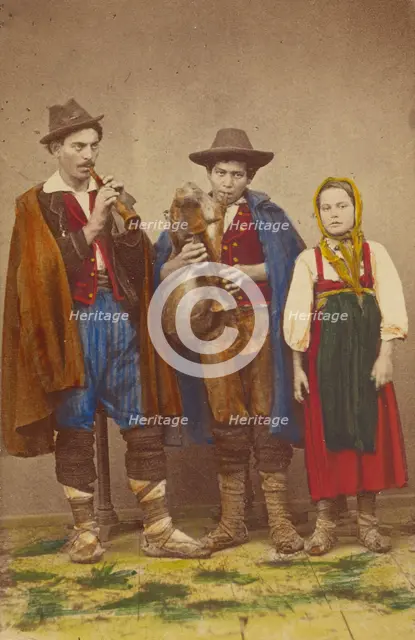 Three Italian peasants standing: two men playing wind instruments, a girl next to them, 1865-1875. Creator: Giorgio Conrad.