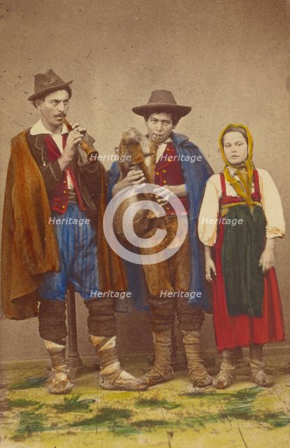 Three Italian peasants standing: two men playing wind instruments, a girl next to them, 1865-1875. Creator: Giorgio Conrad.