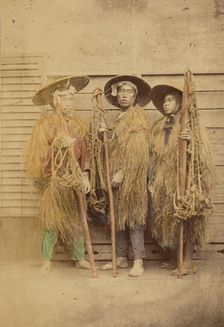 Three Japanese men in grass robes and wide-brimmed hats, 1868-1880. Creator: Felice Beato