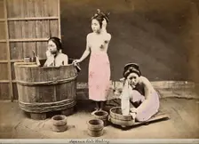 Three Japanese women washing: One in a wooden tub, one standing and one crouching..., c1890s. Creator: Unknown