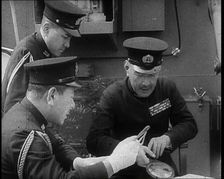 Three Male Japanese Naval Officers in Uniform Discuss Military Plans, 1937. Creator: British Pathe Ltd