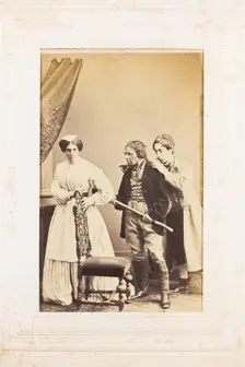 Three men, one in drag, acting out a scene, [between 1890 and 1899?]. Creator: Unknown
