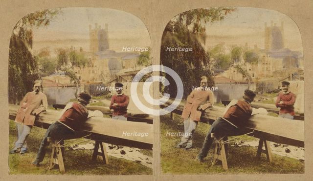 Three men at a table outside, castle in background, 1857-1862. Creator: Roger Fenton.