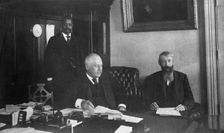 Three men in office in Bureau of Engraving and Printing, Washington, D.C., 1889 or 1890. Creator: Frances Benjamin Johnston
