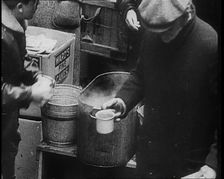 Three Men Receiving Hot Drinks, 1933. Creator: British Pathe Ltd