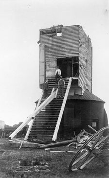Three men standing on the remains of Golden Cross Windmill, Chiddingly, East Sussex, 1935. Creator: HES Simmons