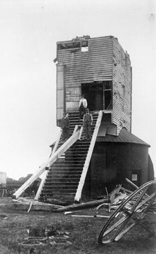Three men standing on the remains of Golden Cross Windmill, Chiddingly, East Sussex, 1935. Creator: HES Simmons