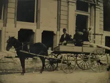 Three Men Seated in a Horse-Drawn Buggy in Front of a Building Under Construction, 1850s-60s. Creator: Unknown