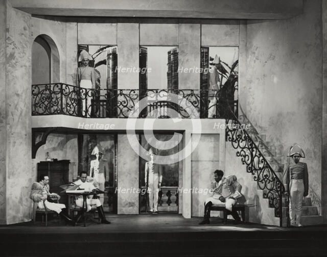 Three men sitting, others on guard, 1938. Creator: Unknown.