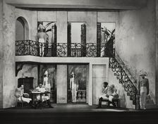 Three men sitting, others on guard, 1938. Creator: Unknown