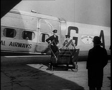 Three Men Tending to a Plane on the Ground, 1933. Creator: British Pathe Ltd