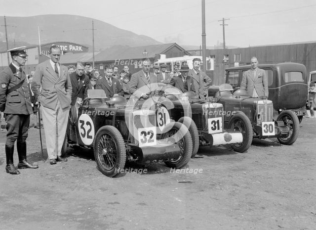 Three MG C type Midgets at the RAC TT Race, Ards Circuit, Belfast, 1932. Artist: Bill Brunell.