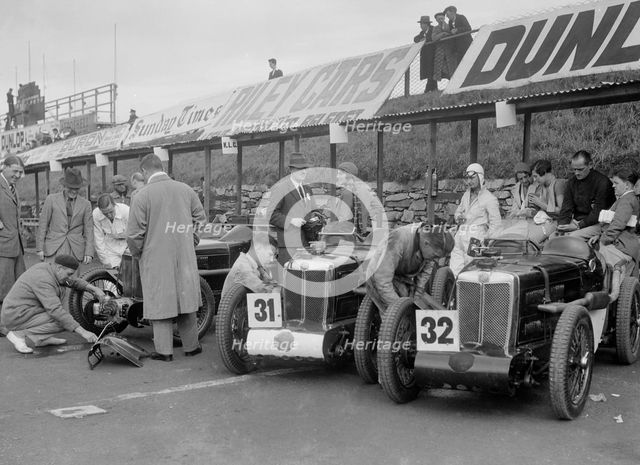 Three MG C type Midgets in the pits at the RAC TT Race, Ards Circuit, Belfast, 1932. Artist: Bill Brunell.