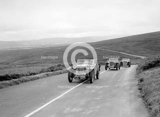 Three MG TAs competing at the MCC Torquay Rally, July 1937. Artist: Bill Brunell.