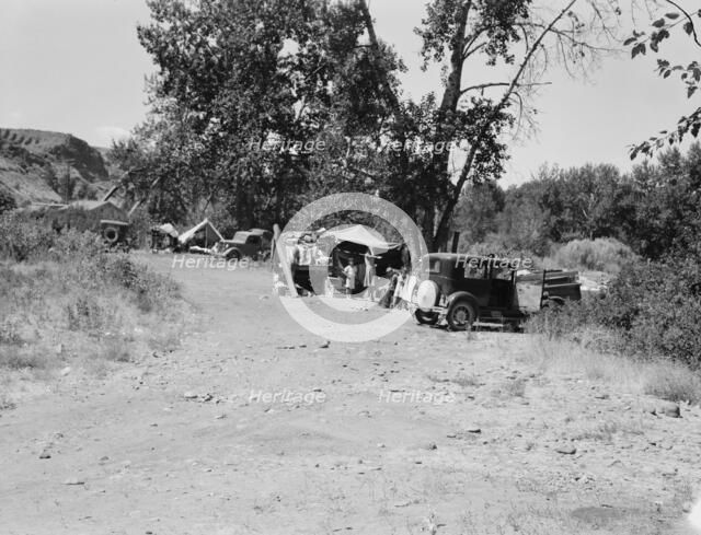 Three migratory families in "Ramblers Park", Washington, Yakima Valley, 1939. Creator: Dorothea Lange.