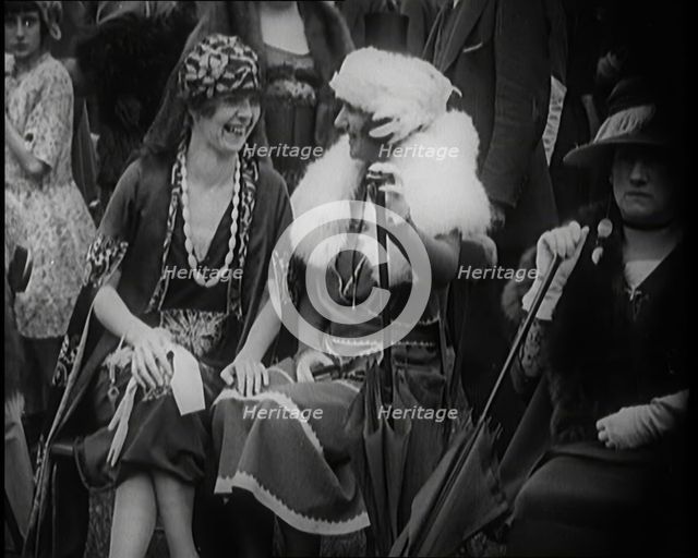 Three Smartly Dressed Female Civilians Sitting on Chairs, 1924. Creator: British Pathe Ltd.