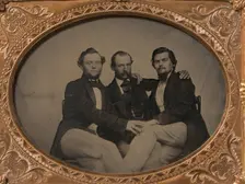 Three Seated Men with Arms Around Each Other, 1860s. Creator: Unknown