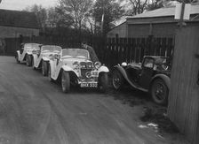 Three Singer cars and a MG PA at a motoring trial, 1930s. Artist: Bill Brunell