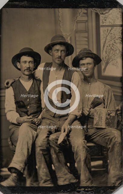Three Painters, with Brushes and a Can of Paint, in Front of a Painted Window Backdrop, 1870s-80s. Creator: Unknown.