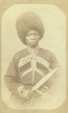 Three-quarter length portrait of man, seated, facing front, between 1870 and 1886. Creator: George Kennan