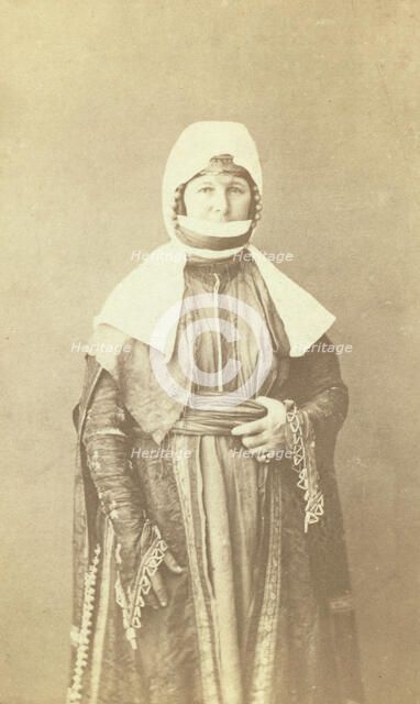 Three-quarter length portrait of woman, facing front, between 1870 and 1886. Creator: Unknown.