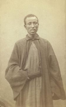 Three quarter portrait of African man, facing front, between 1870 and 1886. Creator: Unknown